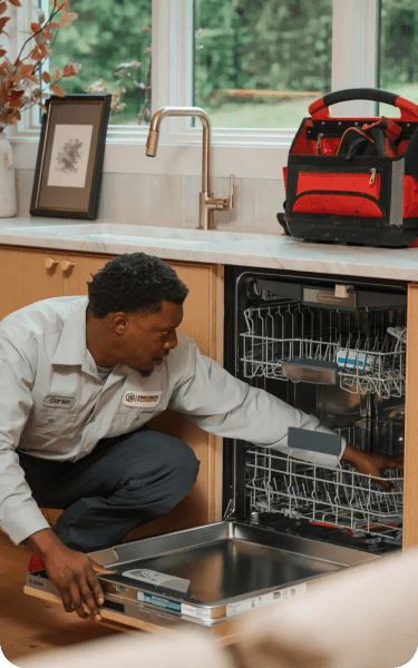 Precision Plumbing technician servicing home plumbing equipment